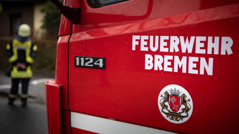 Bremen fire brigade stands on an emergency vehicle 