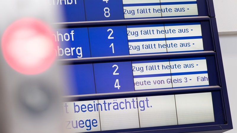 A signal lights up red on a platform at Bremen Central Station.